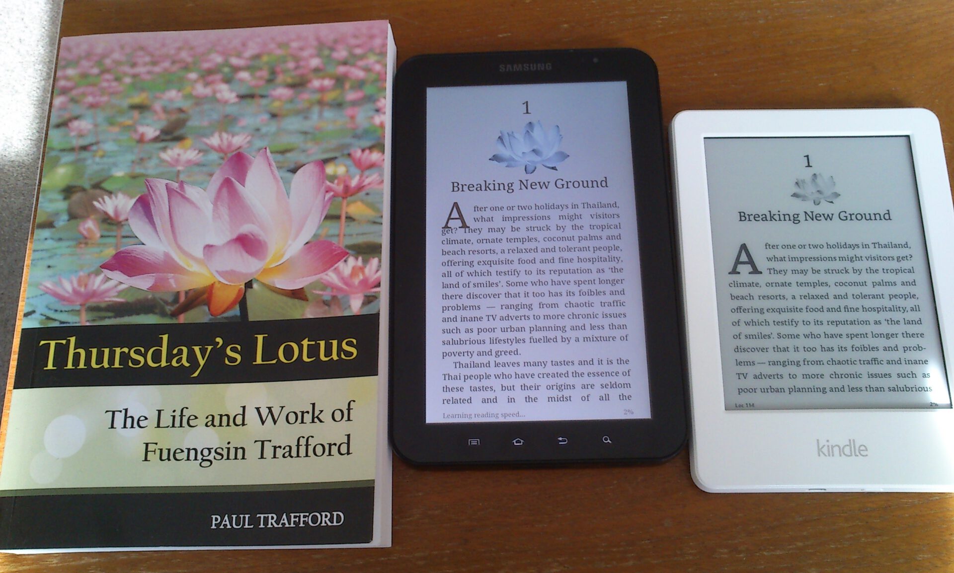 A shot of the paperback version of Thursday's Lotus, alongside the Galaxy Tab and a Kindle.